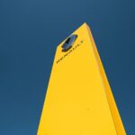 yellow paper plane under blue sky during daytime